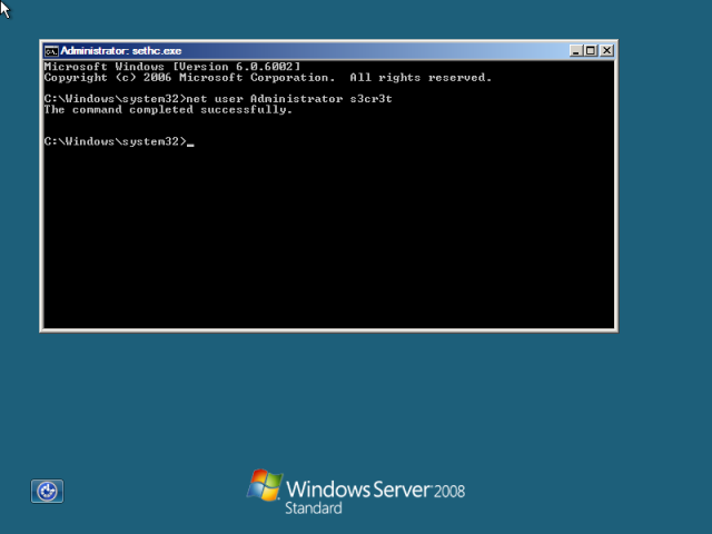 Windows login screen with command shell window